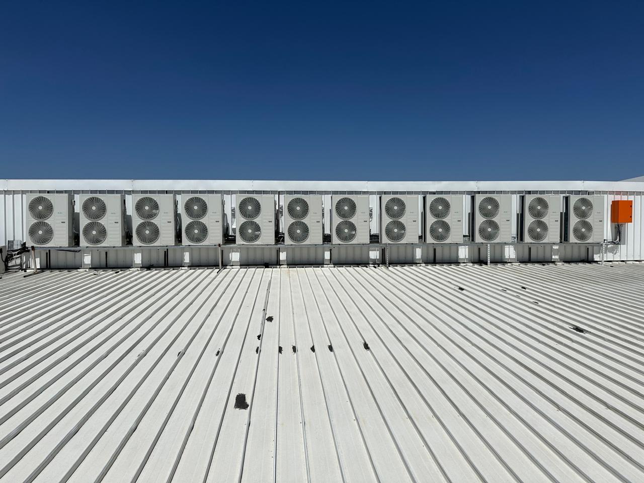 Outdoor air conditioning condenser units serviced by Swift Air in Midrand, South Africa – rooftop HVAC system maintenance.
