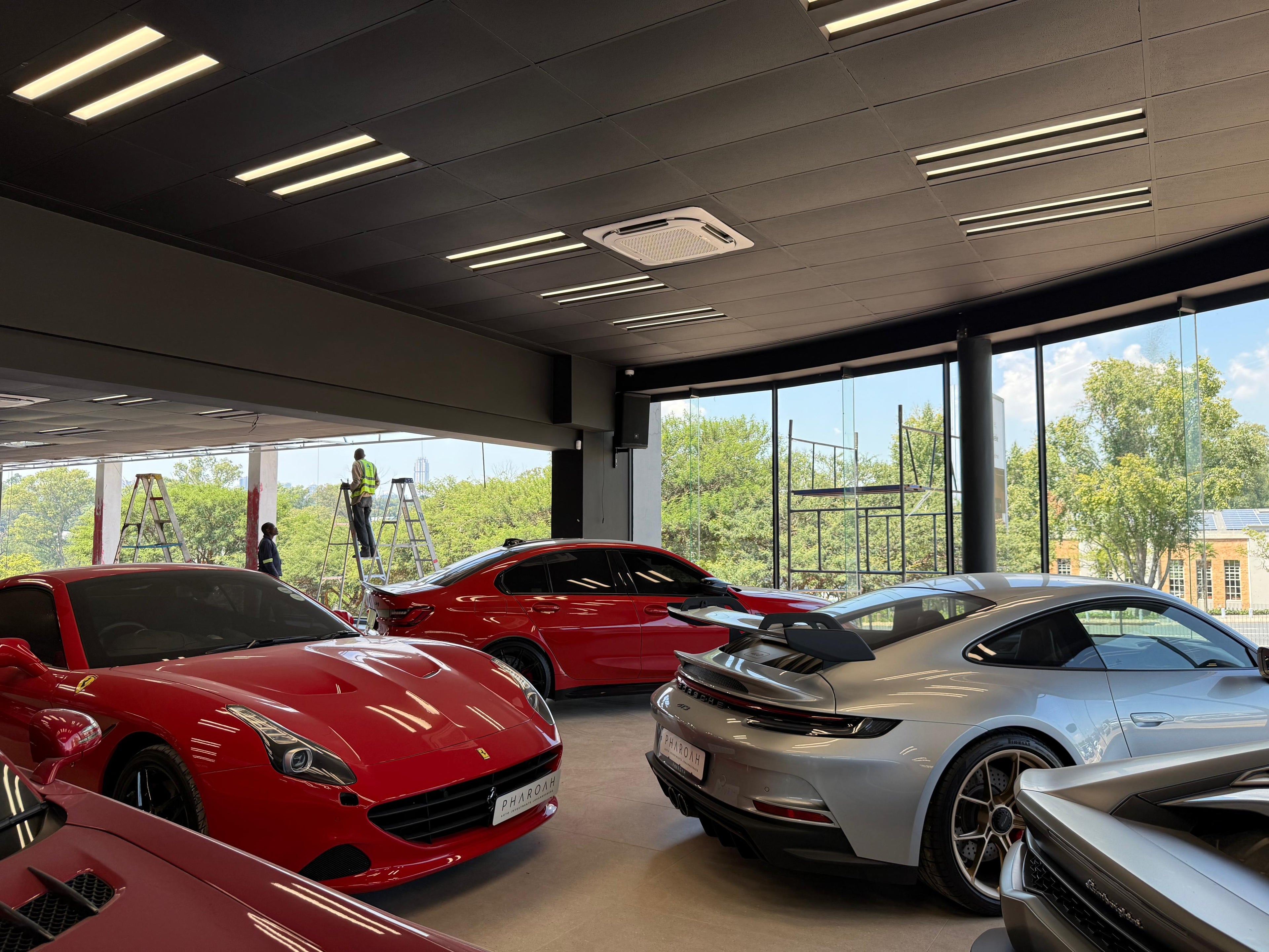 Cassette-type air conditioning units installed by Swift Air at a luxury car dealership in Sandton, Johannesburg – high-performance HVAC for premium spaces.